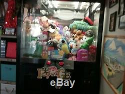 CLAW MACHINE works great. Some plush included