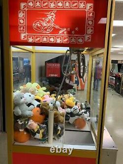 Smart Industries Clean Sweep crane claw machine loaded with toys