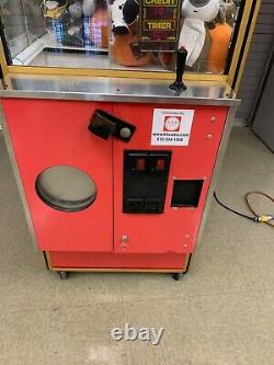 Smart Industries Clean Sweep crane claw machine loaded with toys