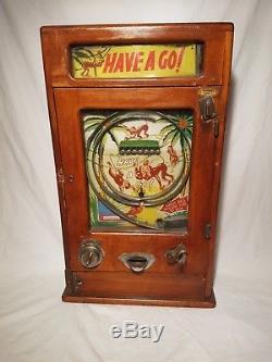 Vintage arcade slot machine fairground circus game takes new pennies working