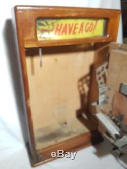 Vintage arcade slot machine fairground circus game takes new pennies working
