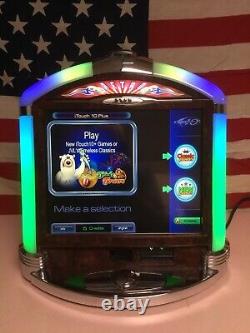 Machine d'arcade rétro Rare JVL avec écran tactile, comptoir et de multiples jeux.
